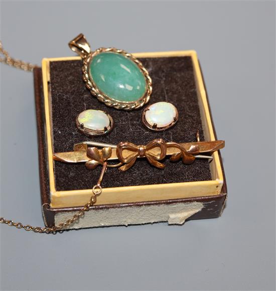 A yellow metal and jade pendant on 9ct chain, a 9ct brooch and a pair of 9ct and white opal earstuds.